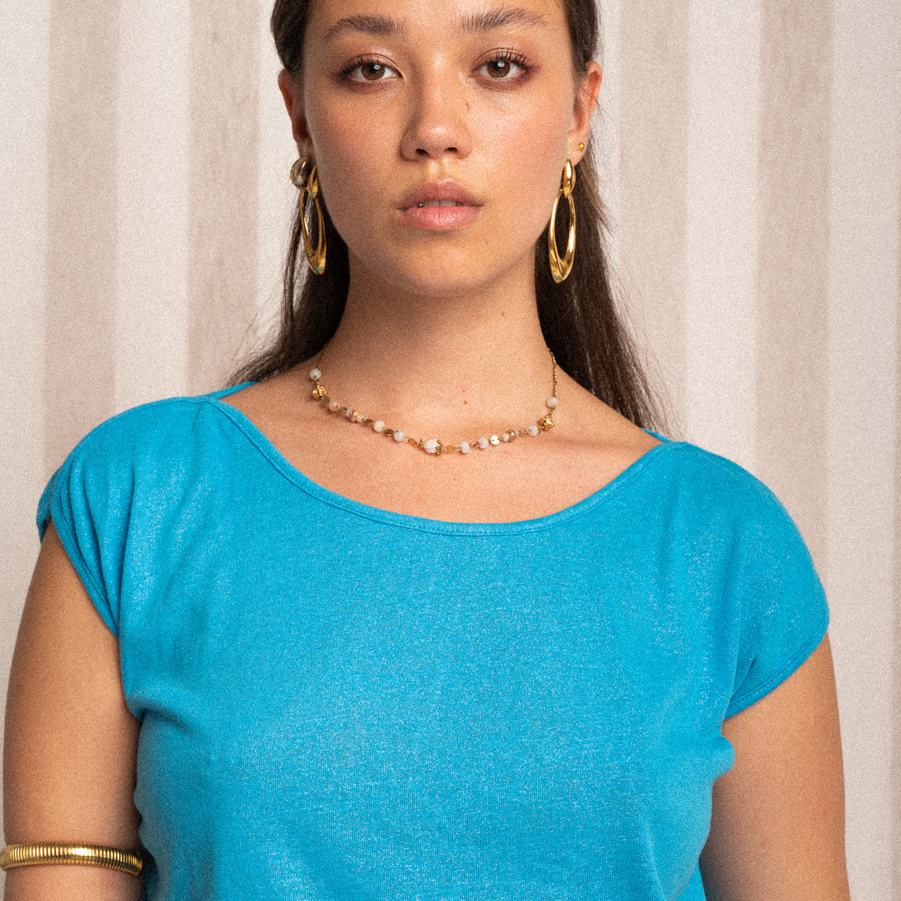 Top smanicato azzurro