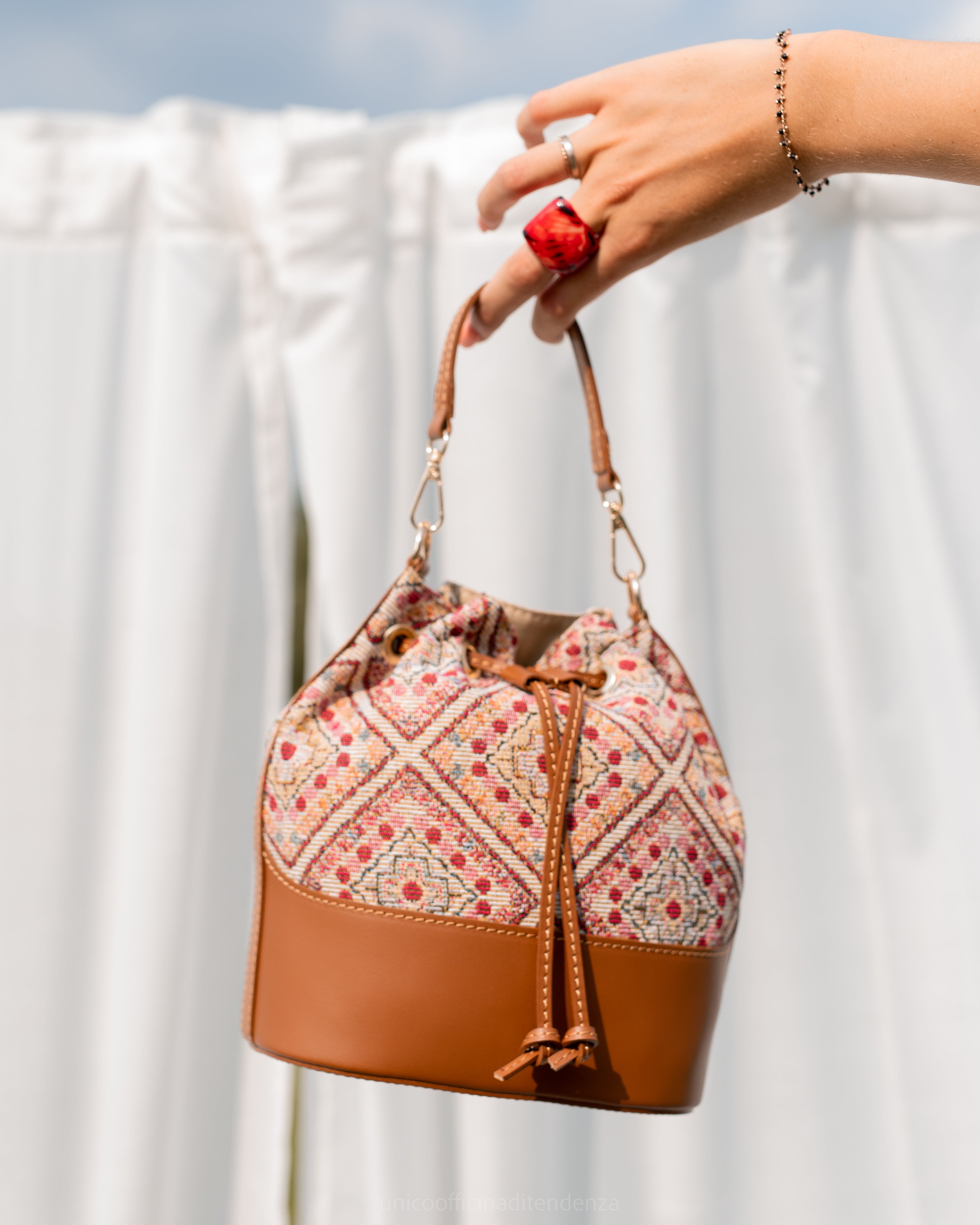 Bucket bag in leather and jacquard fabric