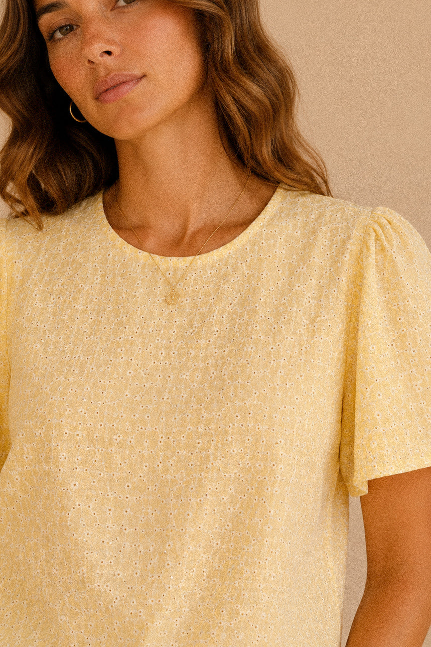 Top “Lemon Broderie” – top giallo con ricami bianchi