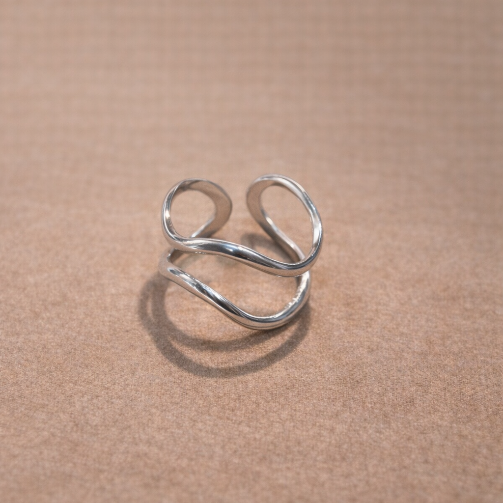 Anello Regolabile in Acciaio Chirurgico – Design Ondulato