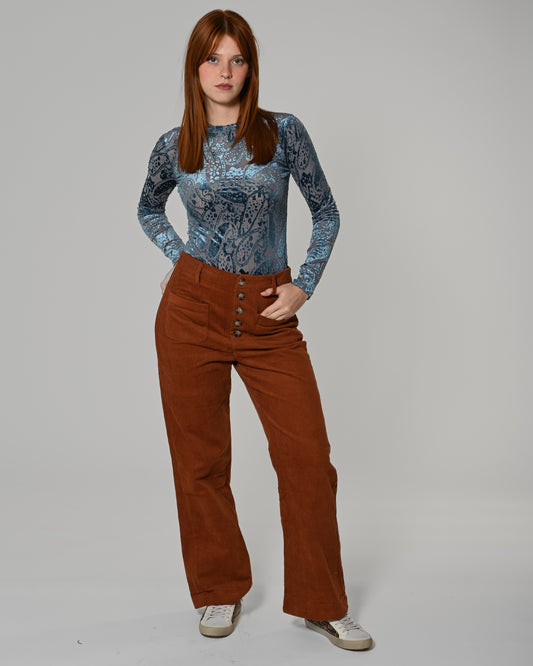 Trousers in velluto color brique