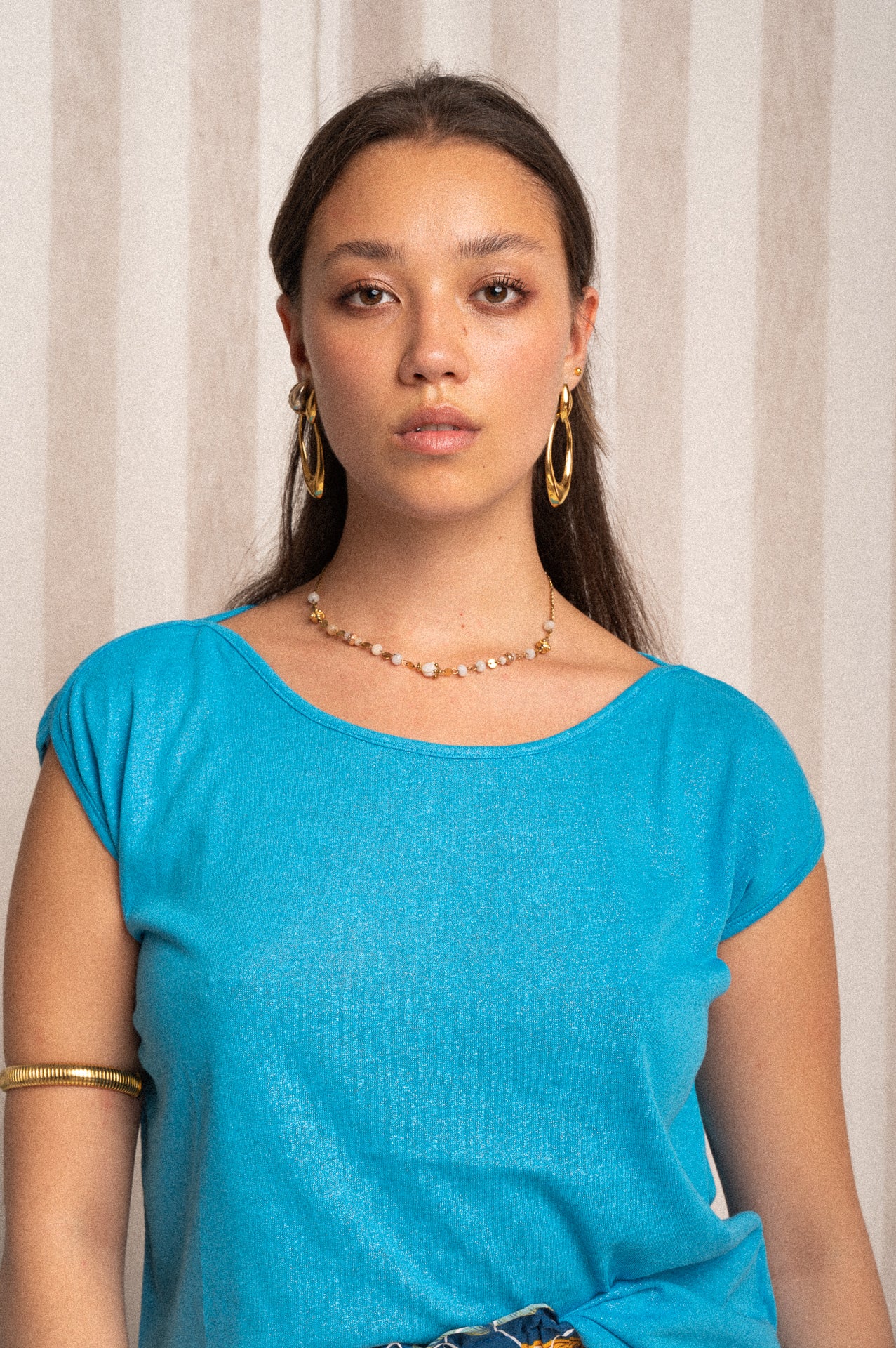 Top smanicato azzurro